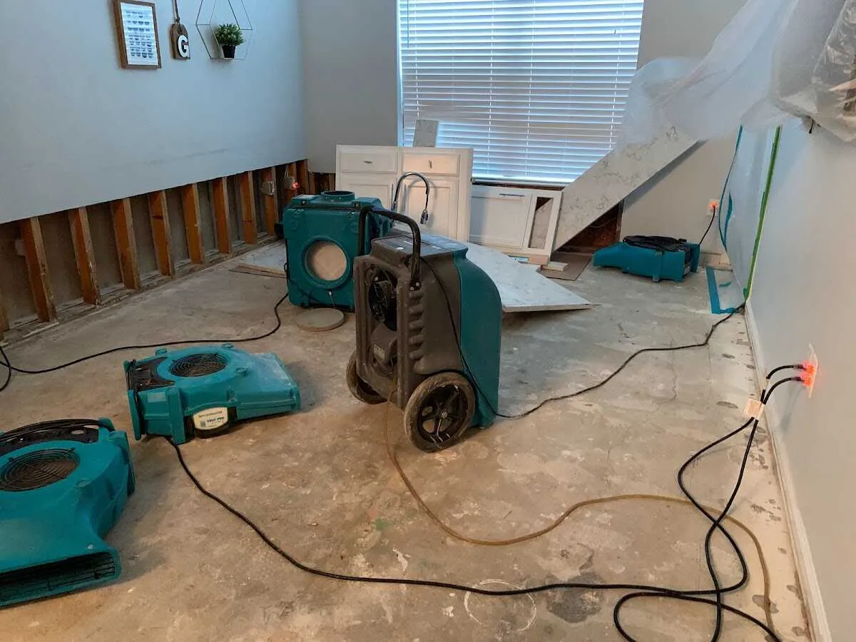 Dehumidifier in flood-cut room for Water Damage Restoration in Dickson